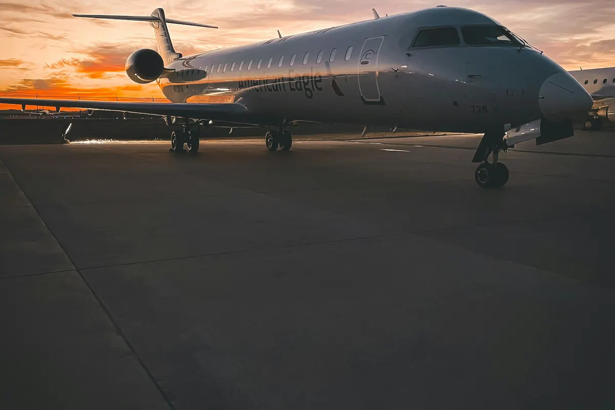 Business jet on the ramp under a dusk sky